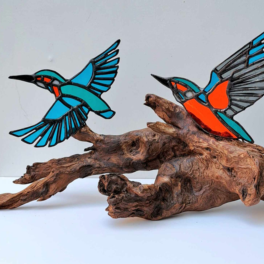 glass kingfishers on wood by David Wettner